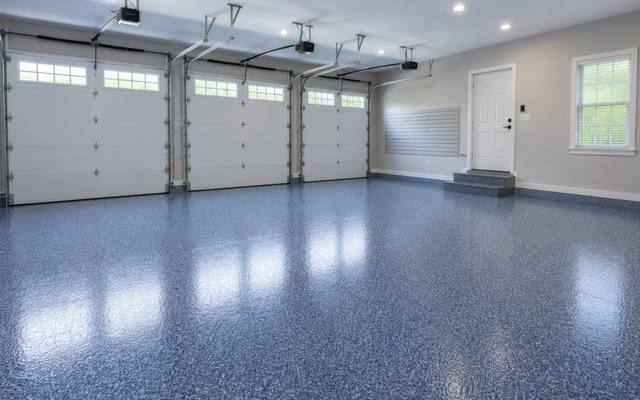 Blue flake epoxy floor in a three-car garage in Guelph